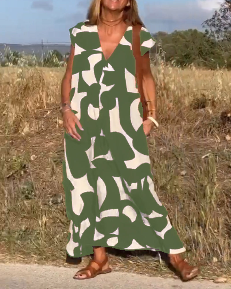 NAOMI | Lange Geprinte Jurk met V-hals en Uitlopende Pasvorm voor een Vakantielook