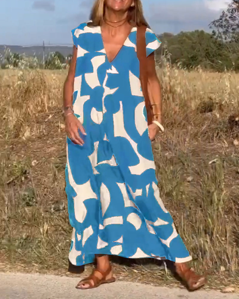 NAOMI | Lange Geprinte Jurk met V-hals en Uitlopende Pasvorm voor een Vakantielook